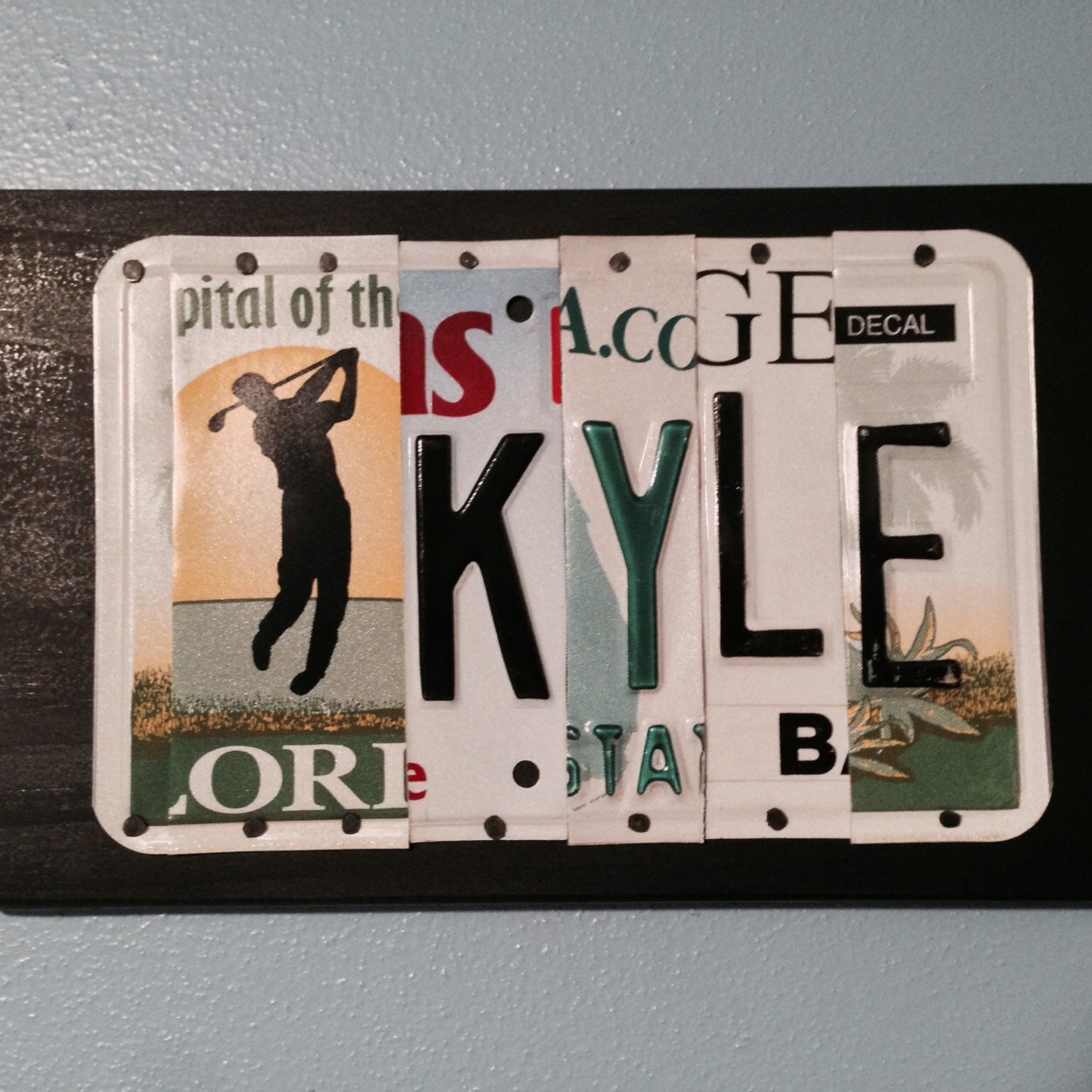 I create custom wood signs made from recycled license plates.  All colors available.  Contact me for one of a kind gifts!  Each sign is unique.