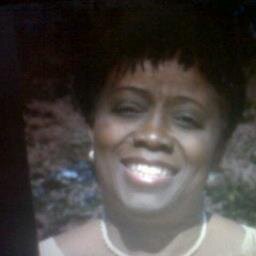 Haitian woman, general/pediatric surgeon, working as Director ai in Training Direction of the Minister of Health.
