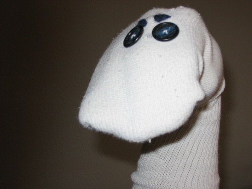 I am a lovable & progressive, somewhat needy, but generally positive therapeutic sock puppet...so much more than a sock, some yarn, & a couple of buttons!