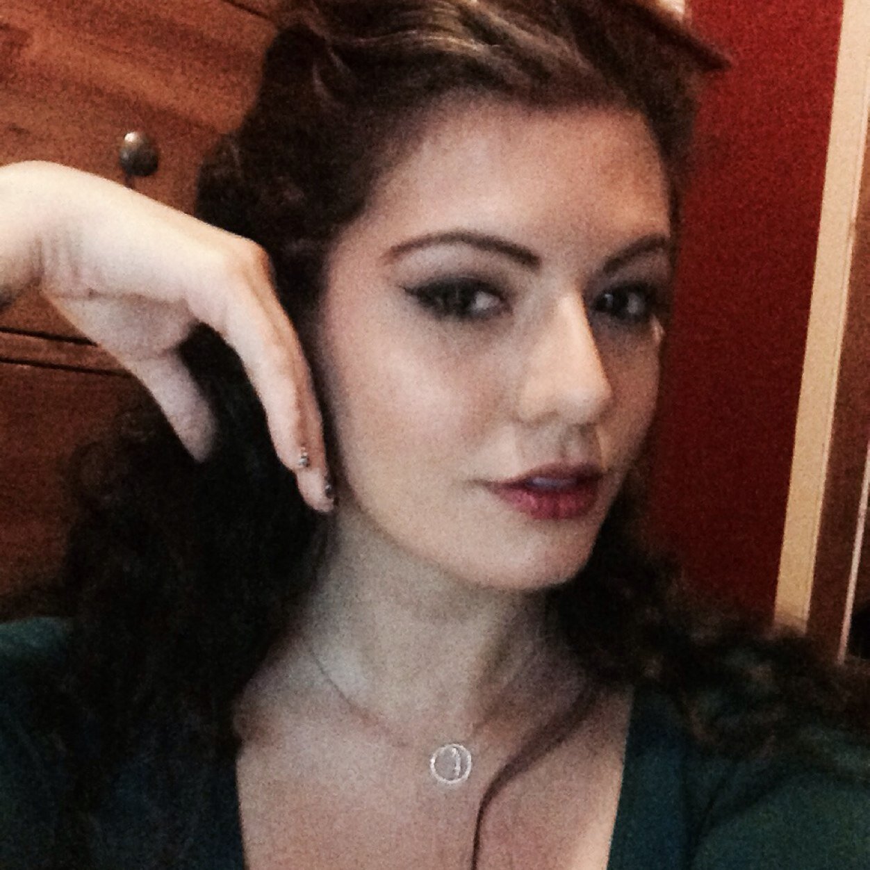 One eyebrow faintly, but permanently, raised