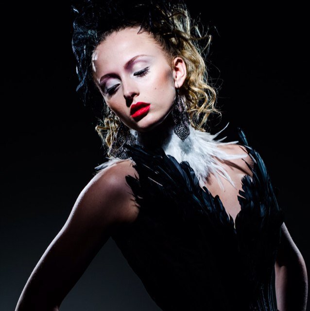 Corsetiere specializing in high end bridal & reproduction corsets