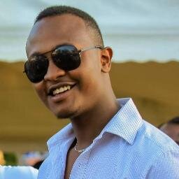 **Gitari Macharia ™®