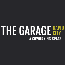 A former auto repair shop converted into a contemporary coworking space in downtown Rapid City, South Dakota, for small businesses and freelance creatives.