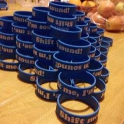 Wristbands. €2.5O. Funny Slogans. Irish. Extremely Successful. Buy em' if you want the Shift.