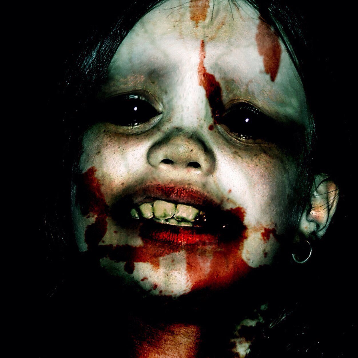 Tweeting scary pictures. Sensitive people are not recommended to follow, you've been warned.