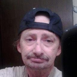 Mean,ugly old man likes Karaoke and sci-fi(esp. Doctor Who) and hates children and pets.