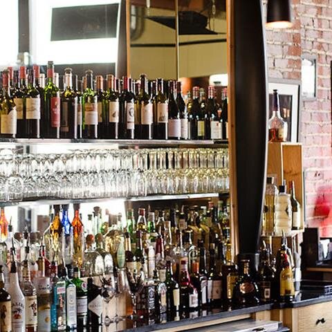 Cozy bar with cheap eats and a huge wine selection! Cafe with in house roasted coffee! Come by the bar Saturdays for live music or hit up the cafe for Brunch!