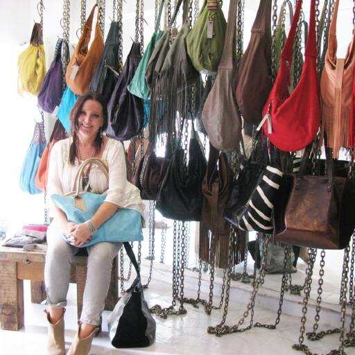 colorful leather bags, belts, leggings, boots and wallets