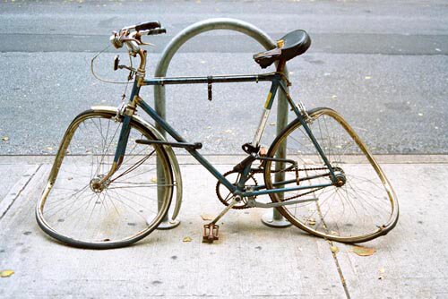 Dead and abandoned bikes around NYC take up what little bike parking we have. Help fix it.