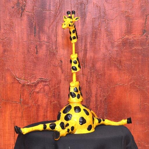 I am a self-taught artist.  I take lost/discarded treasures and turn them into  make you laugh sculptures!