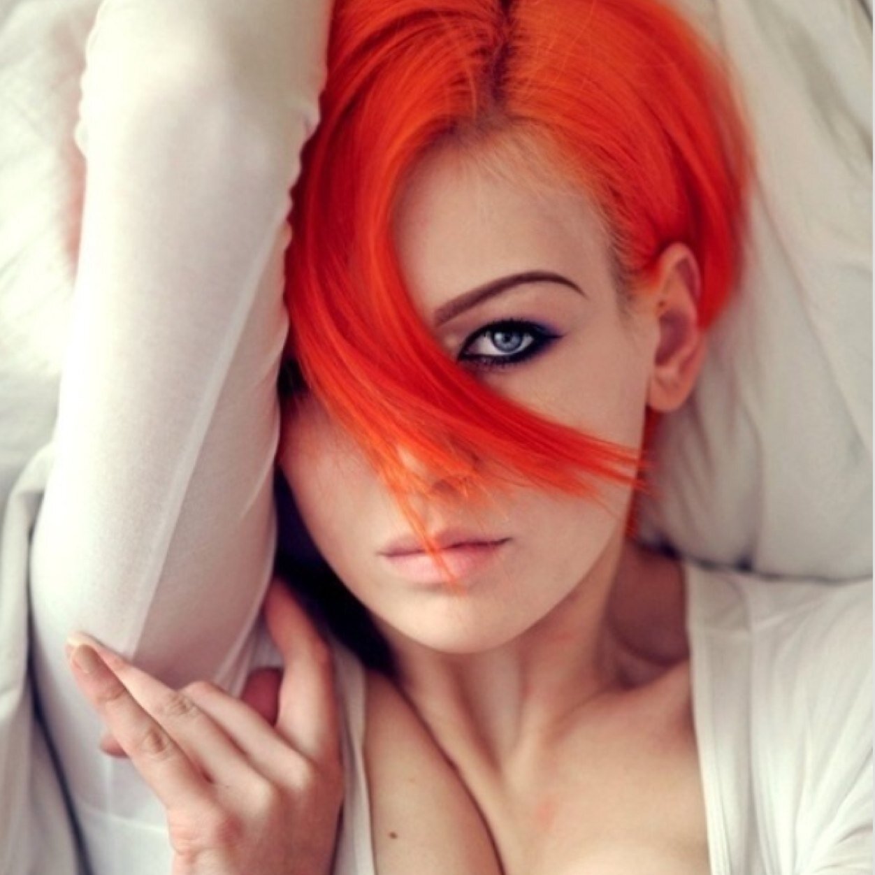 I'm that orange haired girl with a smile on her face, Looking down at the world for what it has become and what it will turn too.. I'm the never ending torture.