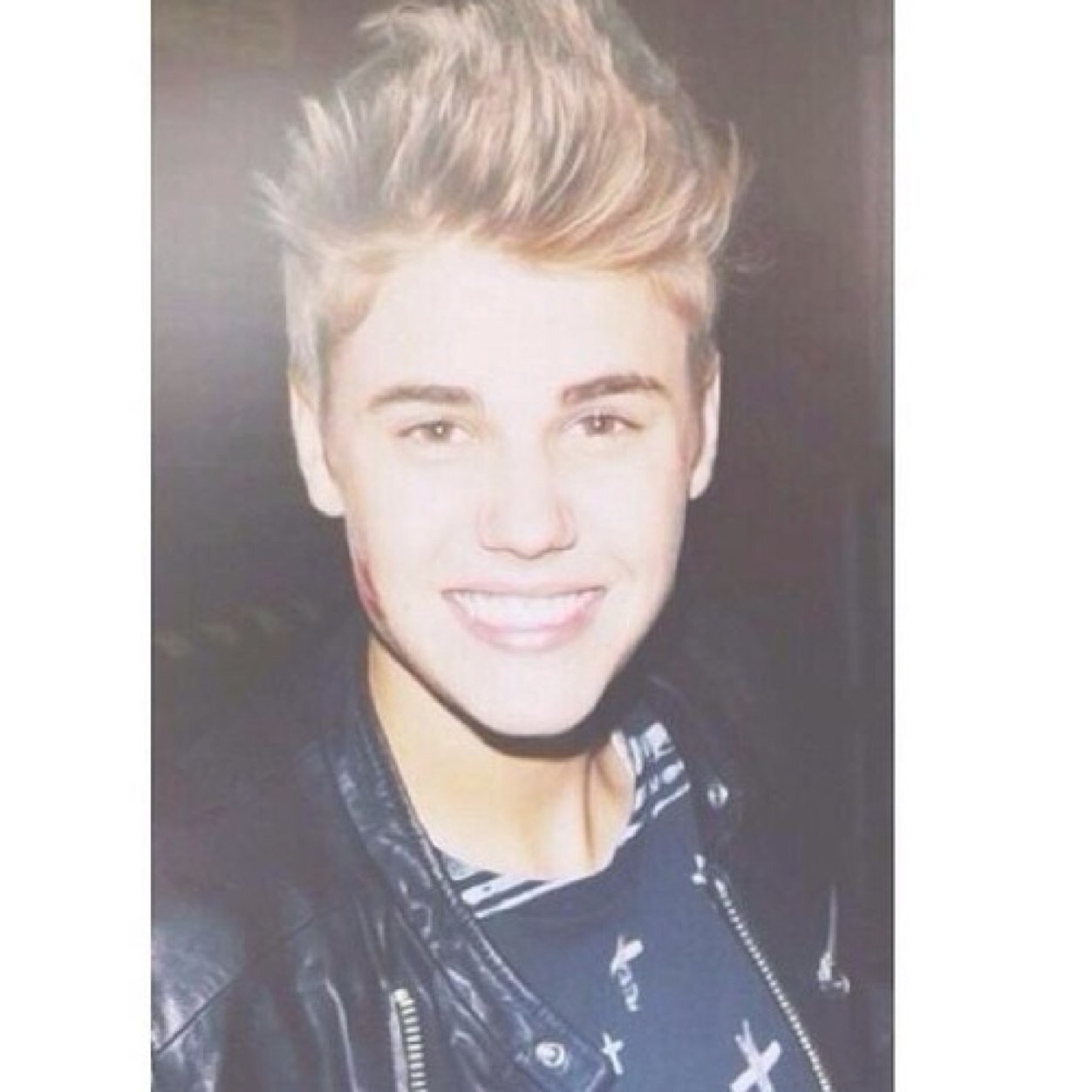 Behind the leather jacket is the grey hoodie, Under the snapback is the hairflip. On the outside he's grown up, but on the inside he hasn't changed at all.