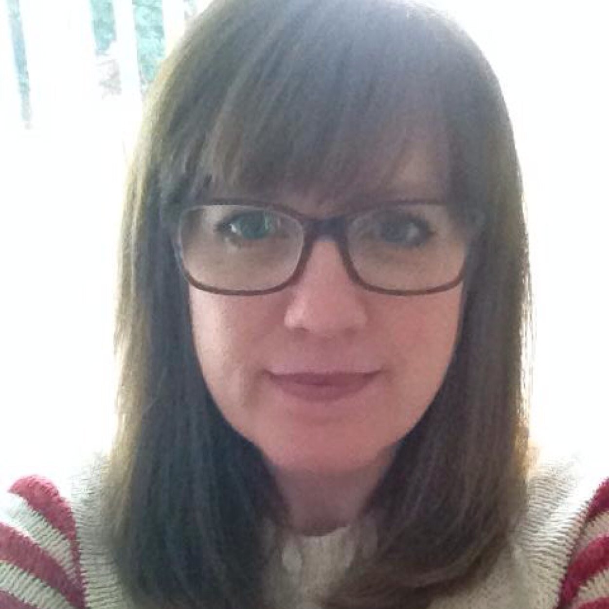 Bobbing about and juggling kids/home/work trying to keep it all in perspective - usually with a strained look on my face!  And nosey - yes I'm very nosey!