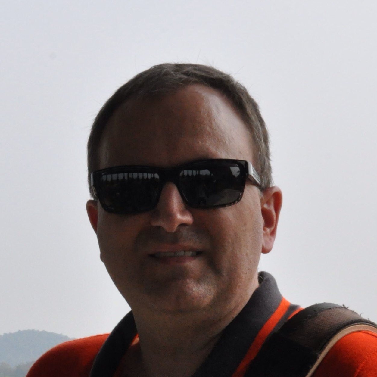 From Wisconsin, lived in Boston, worked at MediSense, Abbott, and now Benchmark in Thailand.