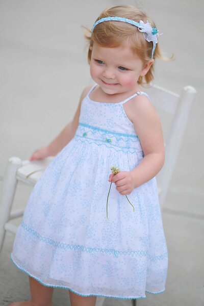 Traditional hand smocked dresses and heirlooms and boys outfits for special occasions made in the most exquisite fabrics.