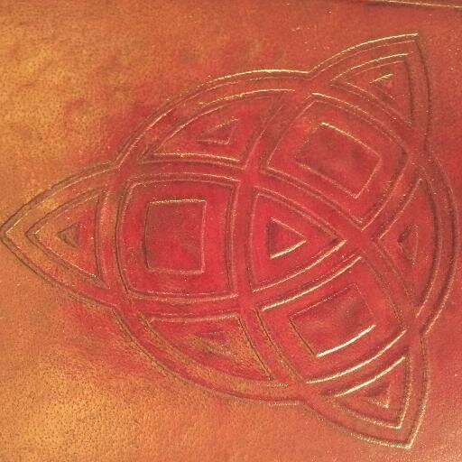 We are a small company featuring handmade leather journals with handmade archival quality recycled cotton paper.