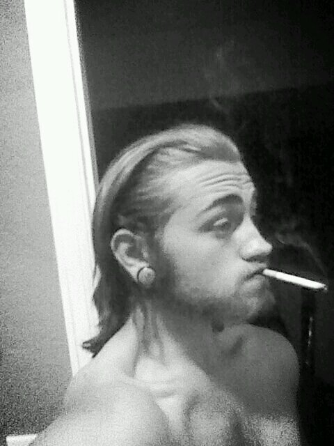 guitar and bass player, smoker, hipster, stoner mentallity, down to earth, happily taken, 3/4 stretched ears, body mods