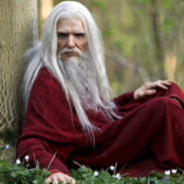 Messanger of the Gods, Emrys travels doing the will of the gods while these mortal kings and queens go about playing their silly game of thrones.