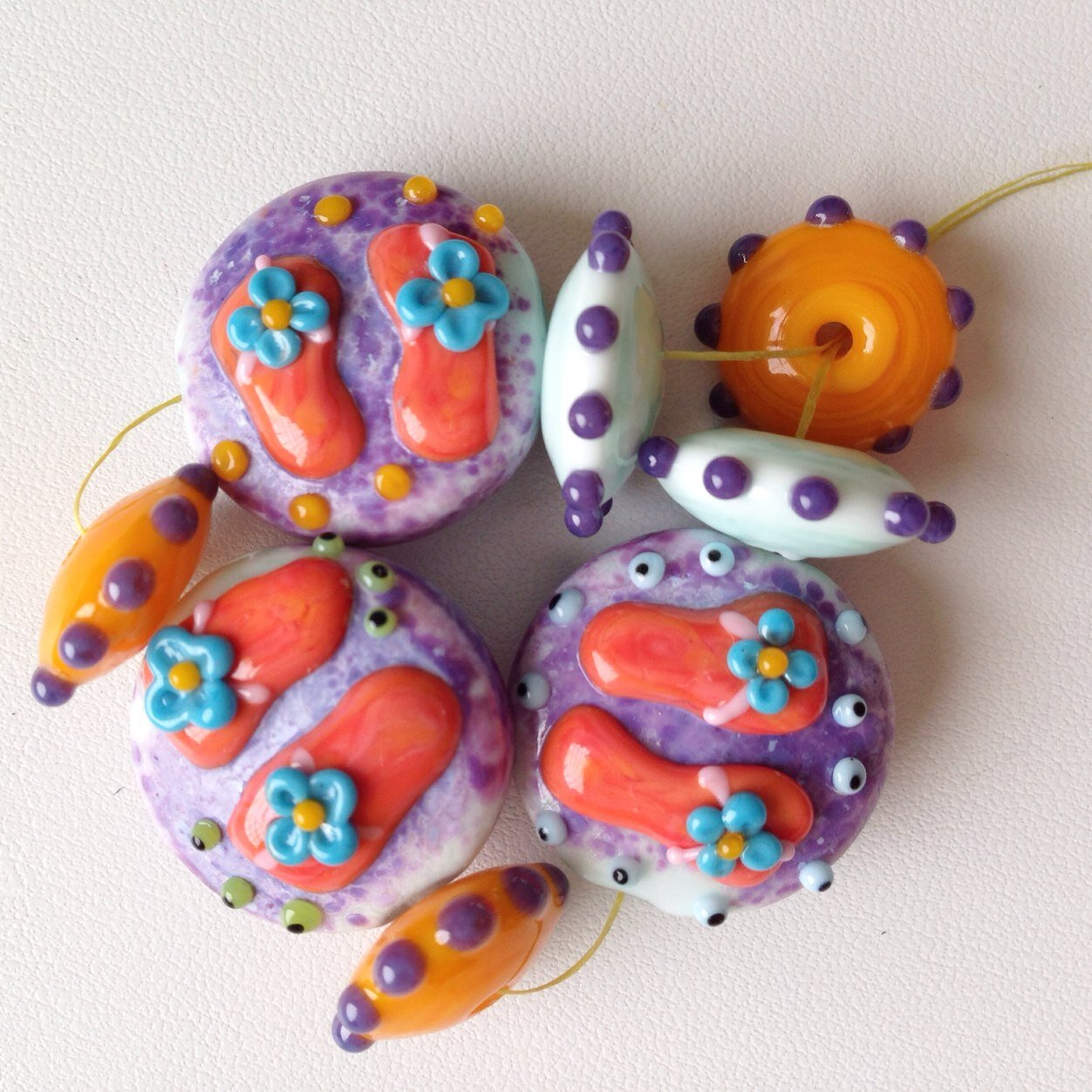 I am a Glass Artist, Mother of 2 and have the best Husband in the world! I enjoy creating glass beads with unique character and color and love sharing my work!