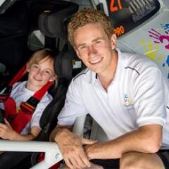 Curly haired Racing Driver now working in F1. Proud Ambassador for The Childhood Cancer Association.