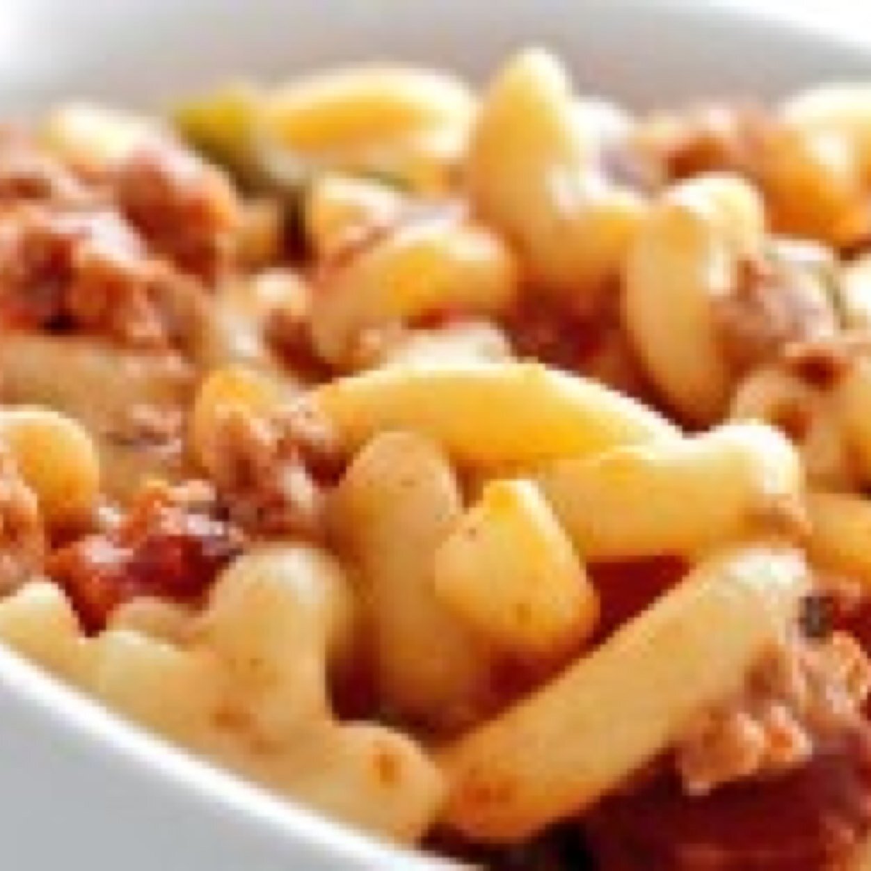 Just a bowl of leftover chili mac patiently waiting to be reheated in a microwave