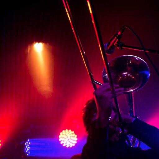 Barefoot trombonist for The Heard