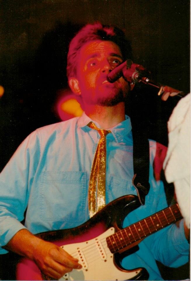 My act is Dave Higgins Presents 70s Troubadours, An Acoustic Tribute. I sing and play live guitar to high-quality MP3 tracks. Very close to the real thing.