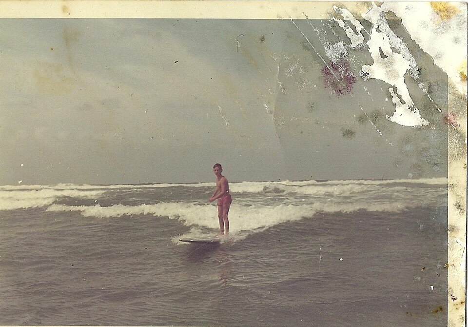 Love surfing,manager at restaurant and happy.