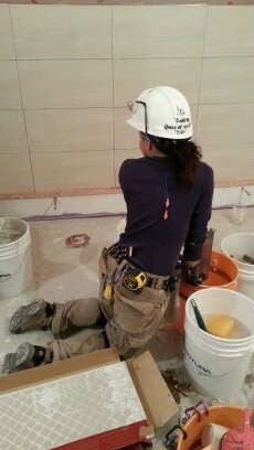 Tiling on volunteer build. Happiest place on earth.