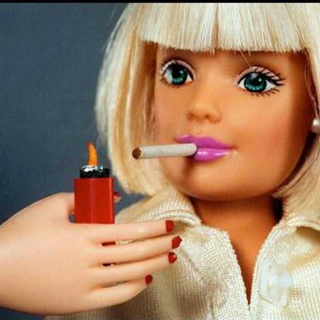 Barbie girl grabbing life & boys by the balls.