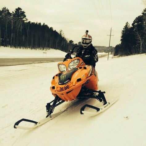Brown baggin' it. Snowmobile in the winter Baseball in the off season.