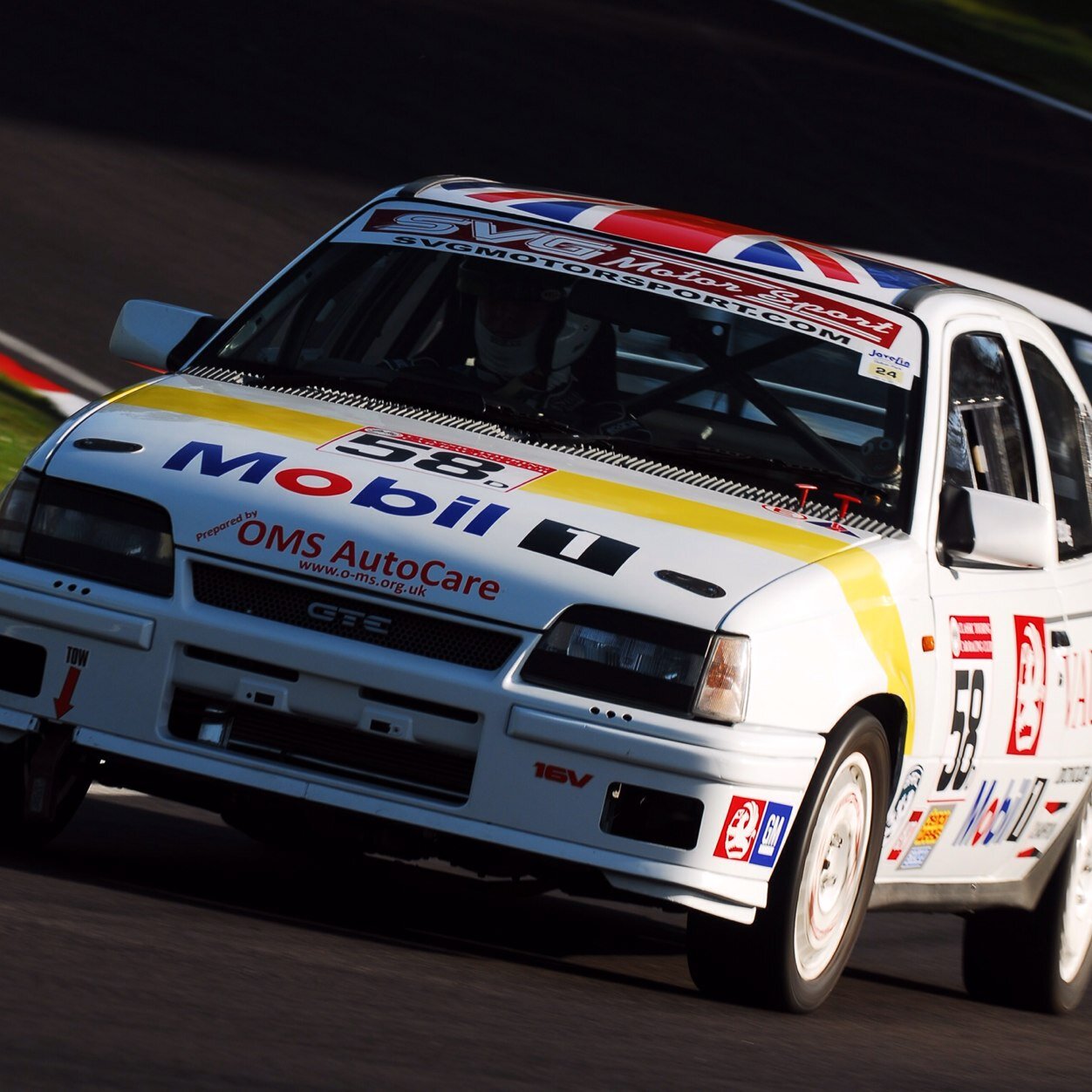 part time racing driver.