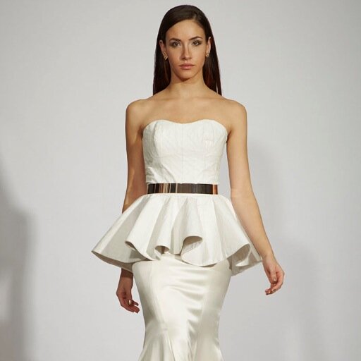 Della Giovanna designs bring an edgy new dimension to bridal wear by mixing leather and hardware with lace and silk.