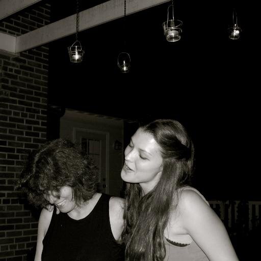 Two ladies, cooking it up.