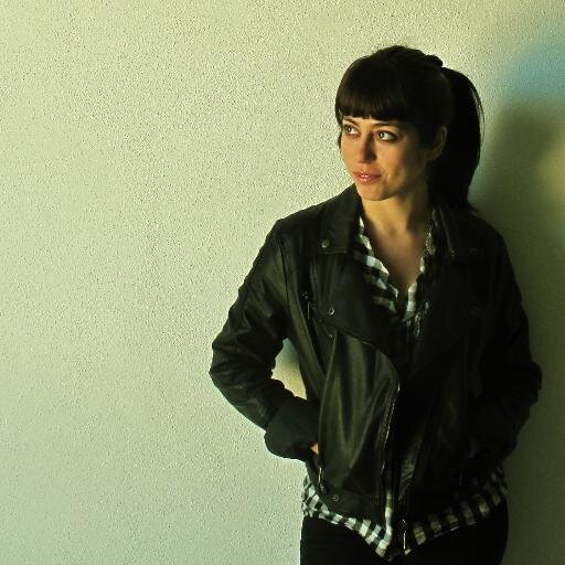 Just a girl, with a trolley, listening Pete Green Corporate Juggernaut.