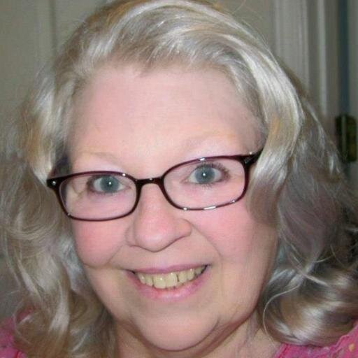 A retired woman, avid reader, liberal, and dog lover.