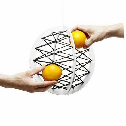 Pluk is a storage device. It has a frame, made out of two circles. The frame then is weaved with elastic string.