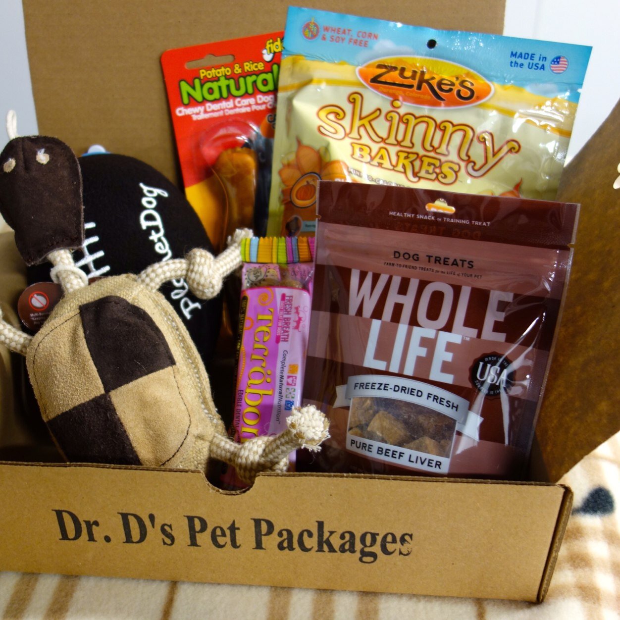 A customized box of toys, treats and supplies selected by our veterinarian, Dr. D, to suit the needs and preferences of your dog or cat.