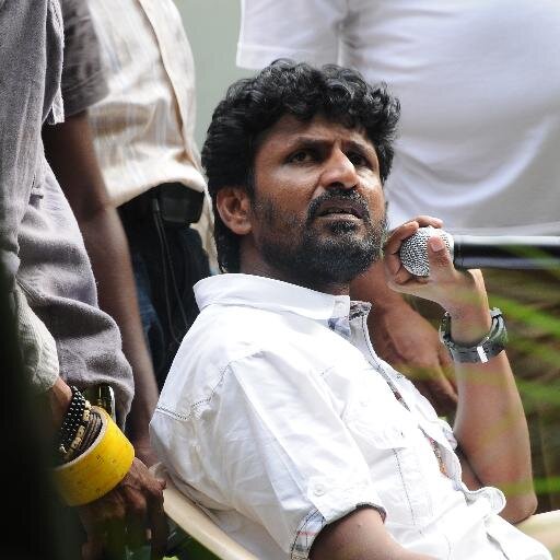 A Film Director,Film distributor and own a film production house respectively called as 'Karunal Films' in Indian Film Industry