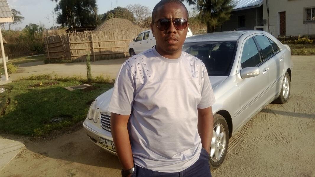 His Majesty's Praise Singer and Swazi Nations People's Poet.  Archivist by profession.