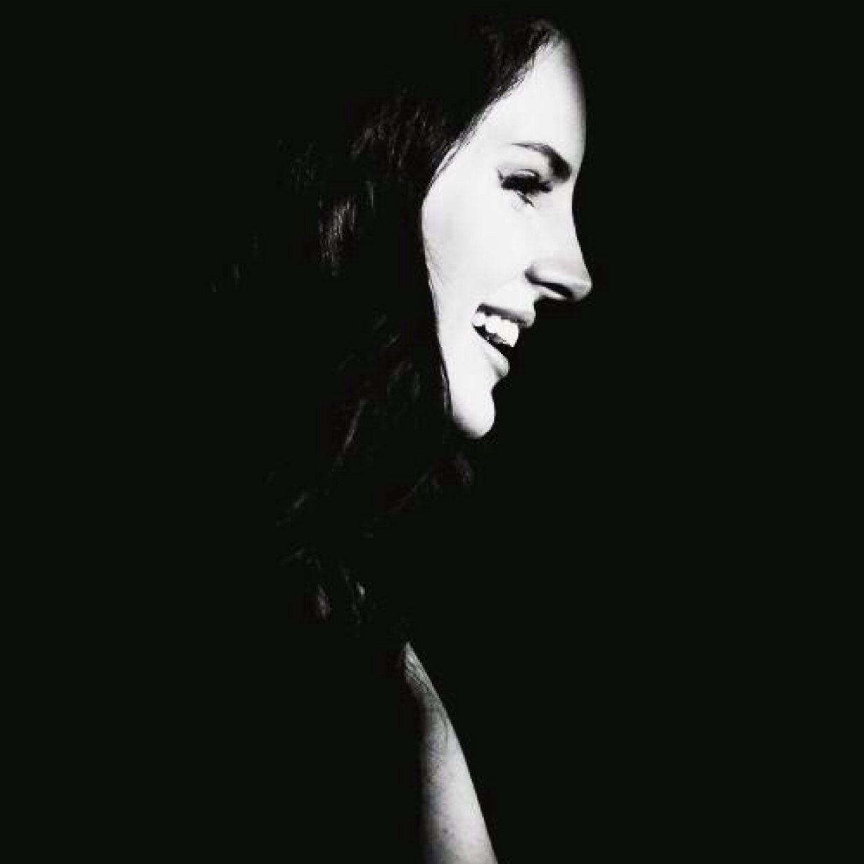 You are tunnel lined with yellow lights on a dark night