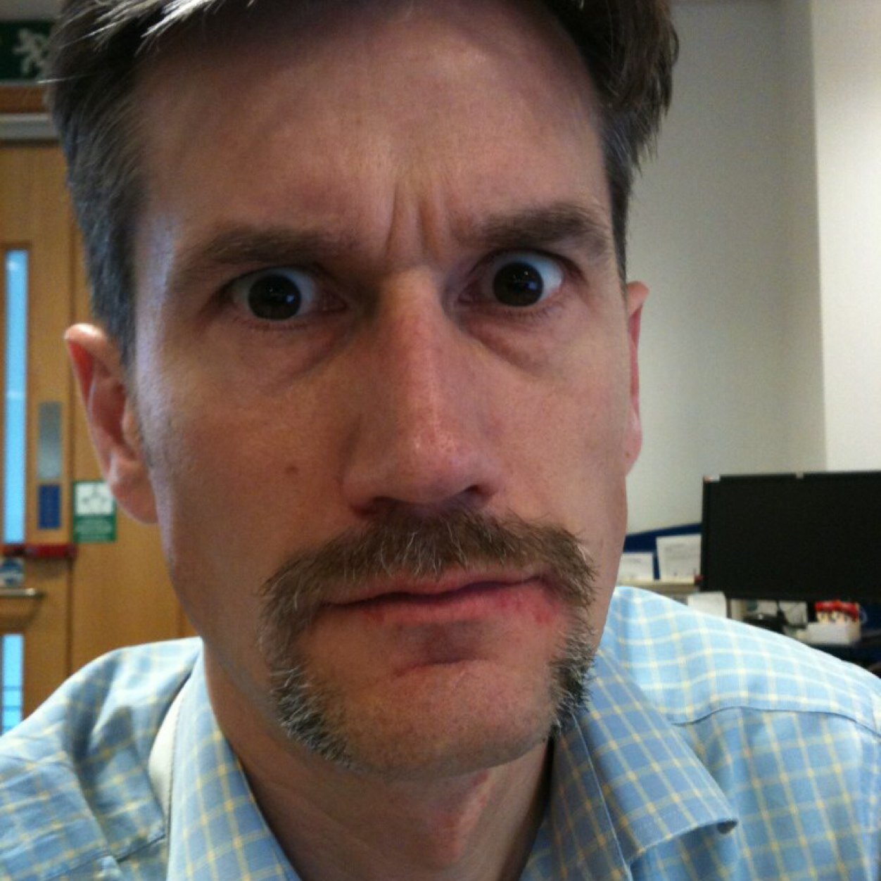 By day, a mild mannered office clerk; by night, a mild mannered office clerk but in the dark.