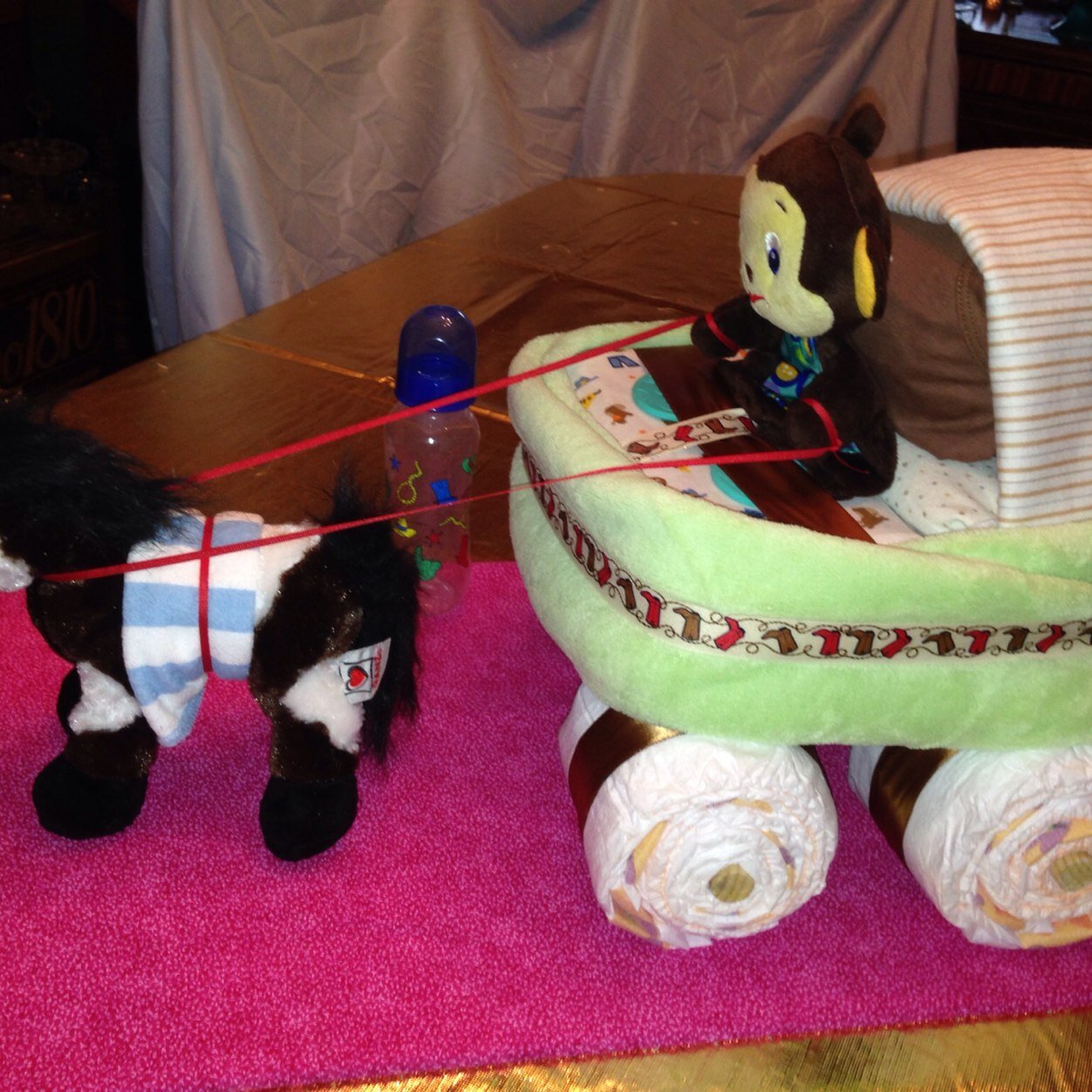 Creating unique 'cakes' made with a variety of baby items such as diapers, blankets, toys, clothes, bibs, hats, socks, etc. Can work with most themes.