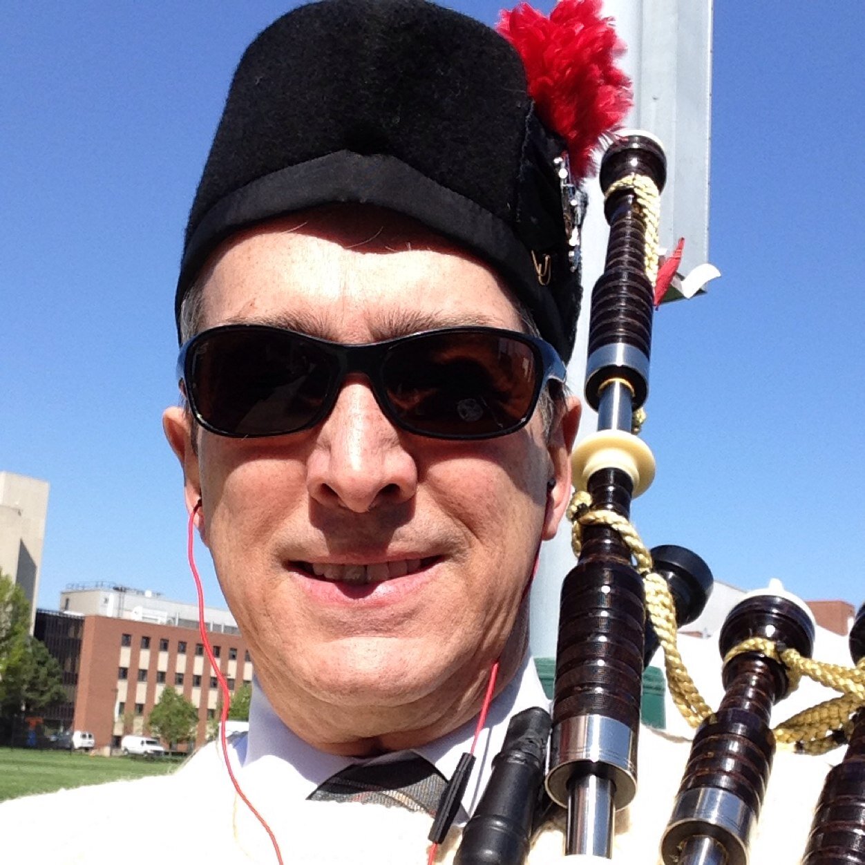 Podiatrist, bagpiper, guitarist, soccer loving educator.