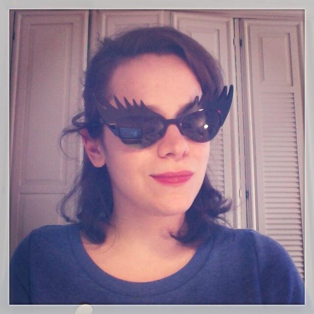 I love my glasses, my sweet dog Truffle, bicycles and, obviously, comics.