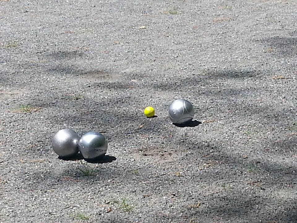 Two players--husband and wife--living in North Carolina and playing the French game of pétanque. It's fun, y'all!