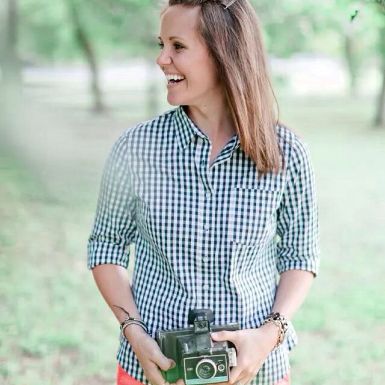I love Jesus, my husband, 3 kiddos, and shooting people...WITH MY CAMERA :)