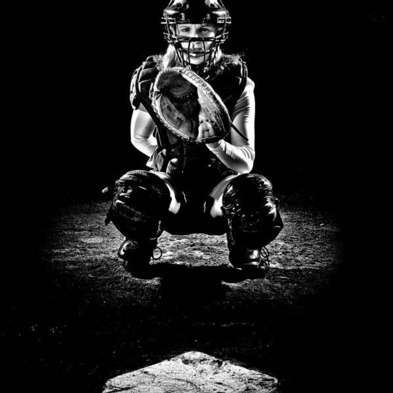 Squattin pretty in the dirty gear behind the plate. Softball is life.