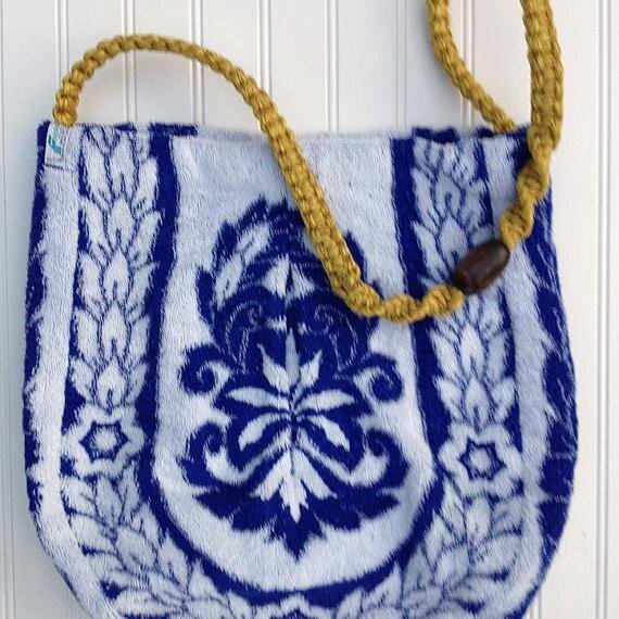 This Vintage Towel Bag is a real statement piece! This is a Greek inspired vintage print towel bag with a macrame strap.