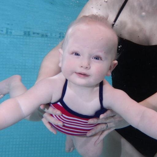 I love to capture the fun and enjoyment that the babies have whilst swimming with their mum and dad.